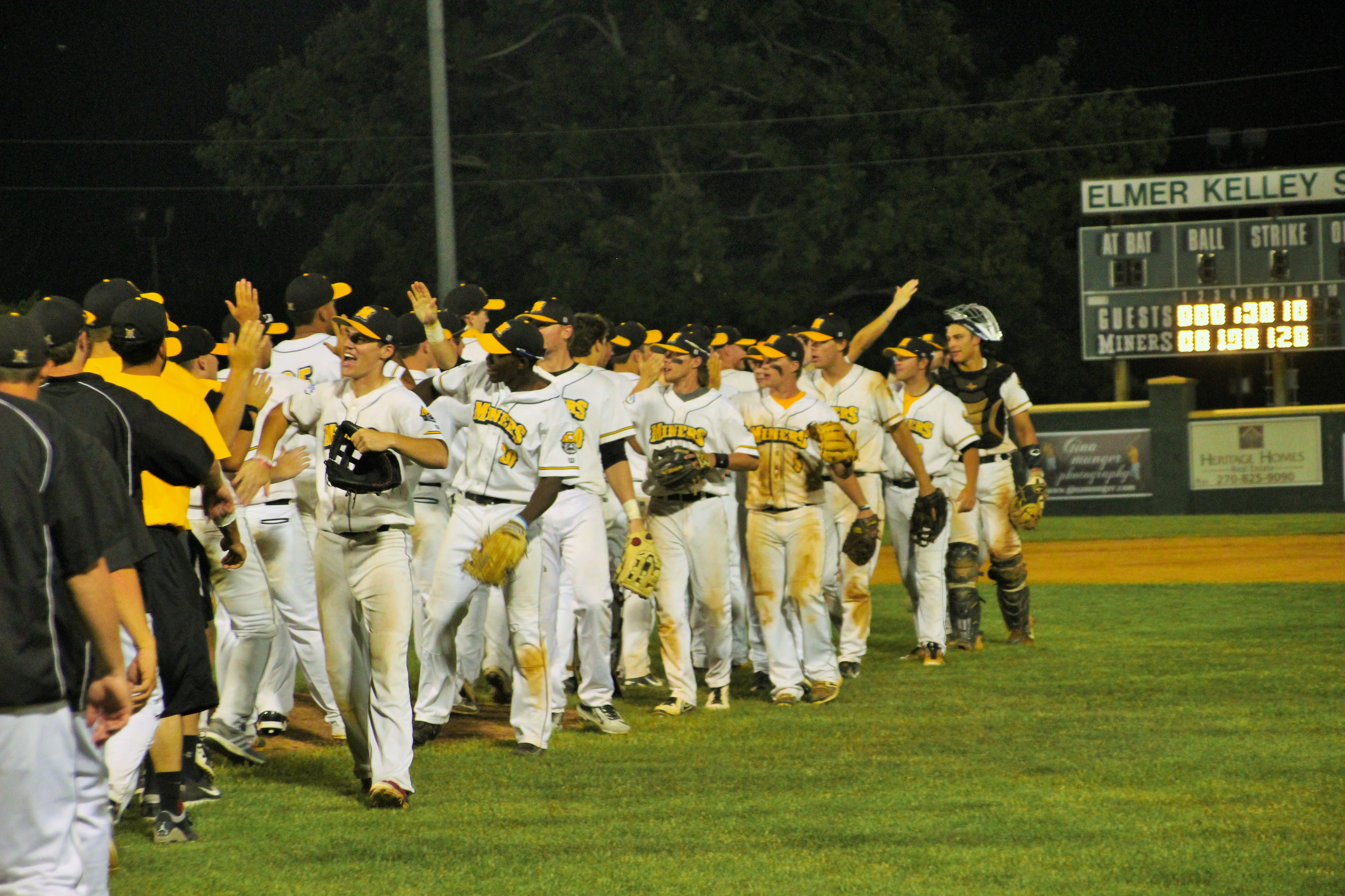 Madisonville Miners baseball team celebrating after game win